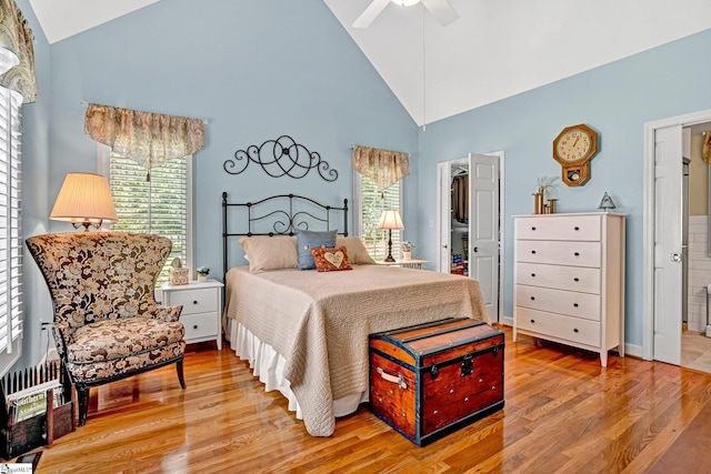 224 Seabright Cir, Cross Hill, SC 29332 - bedroom featuring multiple windows, high vaulted ceiling, light wood-style flooring, and a walk in closet