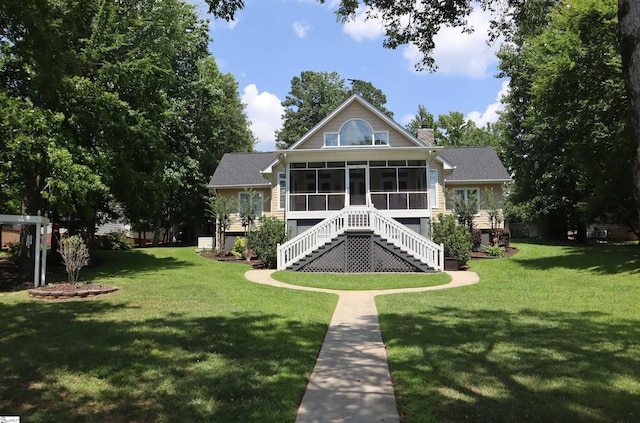 224 Seabright Cir, Cross Hill, SC 29332 - back of house with a sunroom, stairway, a chimney, and a lawn