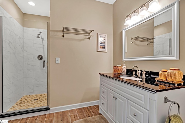 224 Seabright Cir, Cross Hill, SC 29332 - full bathroom with a shower stall, vanity, wood finish floors, and recessed lighting