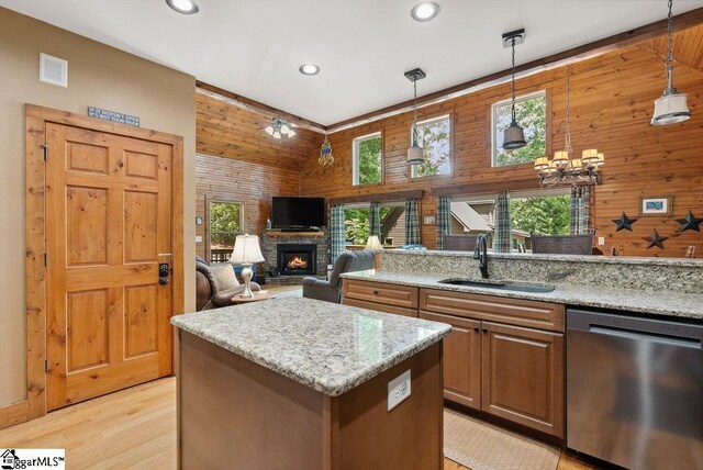 215 Serenity Bay Dr, Seneca, SC 29672 - kitchen featuring stainless steel dishwasher, a fireplace, a kitchen island, recessed lighting, and pendant lighting