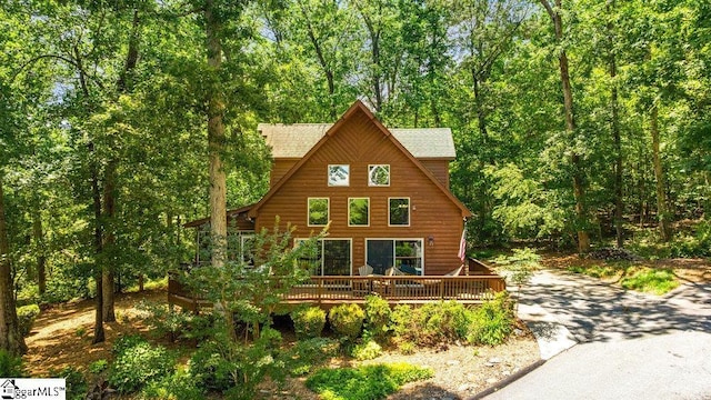 215 Serenity Bay Dr, Seneca, SC 29672 - view of front of house featuring a deck, a view of trees, and asphalt driveway