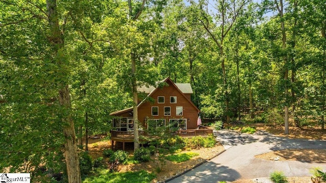 215 Serenity Bay Dr, Seneca, SC 29672 - rustic home with a wooded view, a deck, and asphalt driveway