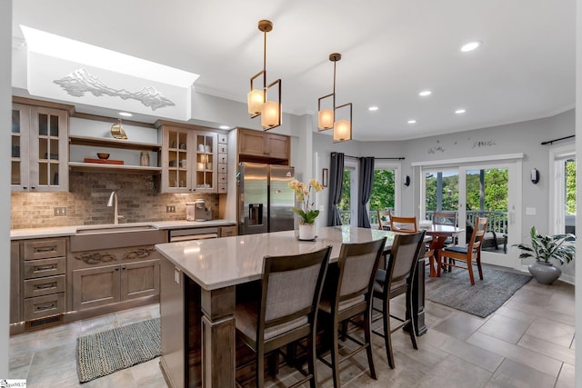 24 Lighthouse Way Dr, Salem, SC 29676 - kitchen with stainless steel refrigerator with ice dispenser, recessed lighting, backsplash, a breakfast bar area, and open shelves