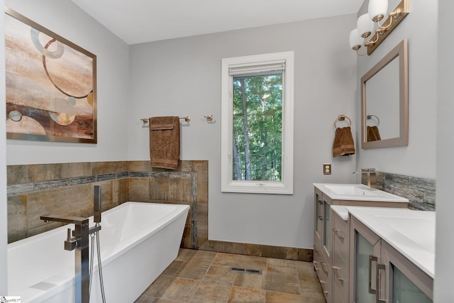 24 Lighthouse Way Dr, Salem, SC 29676 - bathroom with vanity, a soaking tub, stone finish floors, and tile walls
