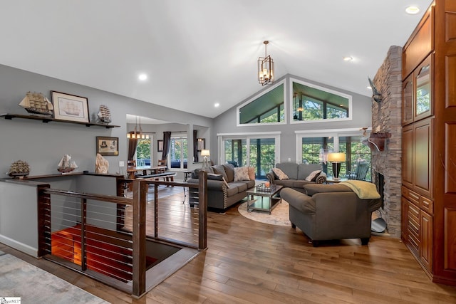 24 Lighthouse Way Dr, Salem, SC 29676 - living room with a chandelier, hardwood / wood-style floors, a fireplace, and high vaulted ceiling
