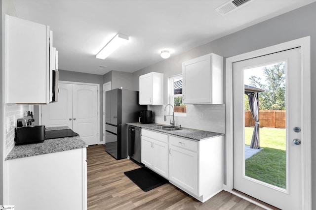 209 Long Grove Ln, Greer, SC 29650 - kitchen with tasteful backsplash, white cabinetry, and stainless steel appliances