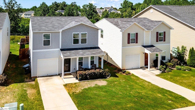 209 Long Grove Ln, Greer, SC 29650 - traditional-style house with an attached garage, driveway, a shingled roof, a front yard, and covered porch