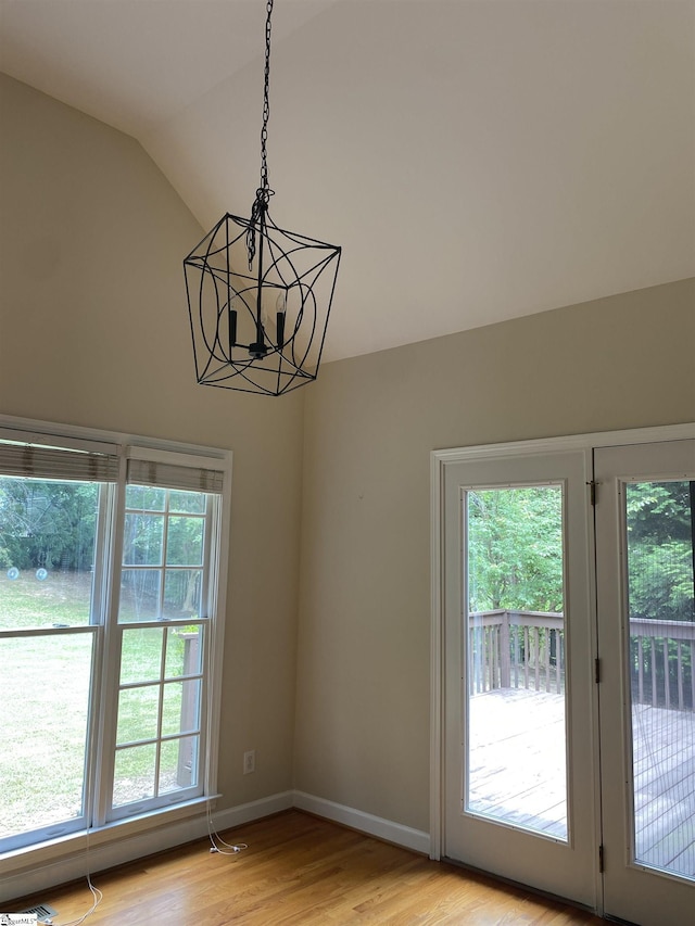 523 Meadowsweet Ln, Greenville, SC 29615 - doorway featuring vaulted ceiling, a chandelier, and light wood-type flooring