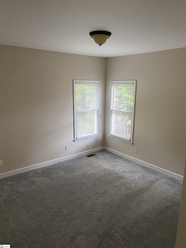 523 Meadowsweet Ln, Greenville, SC 29615 - unfurnished room featuring dark carpet and baseboards