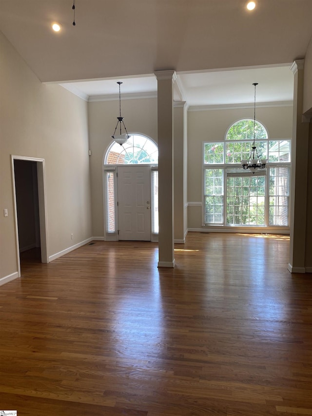 523 Meadowsweet Ln, Greenville, SC 29615 - entryway with a chandelier, dark wood-style floors, ornate columns, crown molding, and recessed lighting