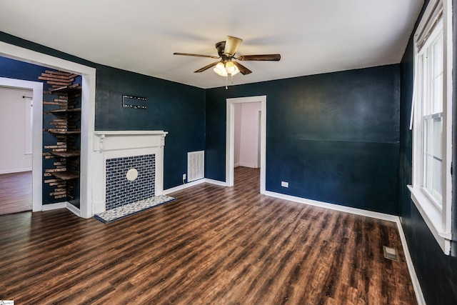 24 Burts St, Pelzer, SC 29669 - unfurnished living room featuring ceiling fan, wood finished floors, and a fireplace