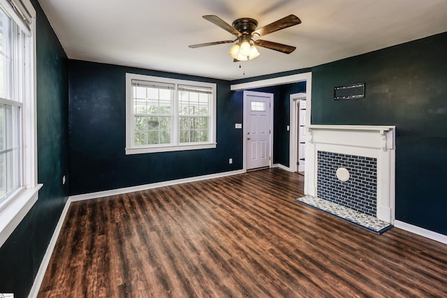 24 Burts St, Pelzer, SC 29669 - unfurnished living room with wood finished floors, ceiling fan, and a tile fireplace