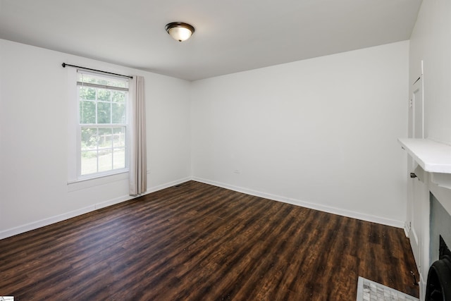 24 Burts St, Pelzer, SC 29669 - empty room featuring dark wood finished floors and baseboards