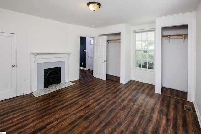 24 Burts St, Pelzer, SC 29669 - unfurnished living room featuring a fireplace with flush hearth and wood finished floors