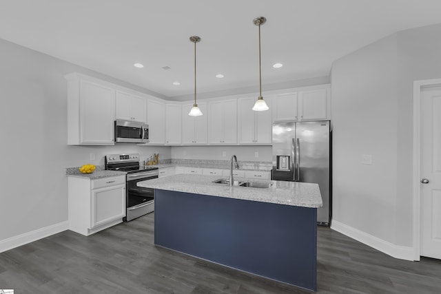 285 Foxbank Cir, Greer, SC 29651 - kitchen featuring stainless steel appliances, white cabinetry, dark wood finished floors, a center island with sink, and decorative light fixtures