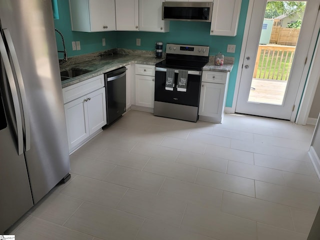 109 Mountain View Ave, Greer, SC 29650 - kitchen featuring stainless steel appliances, white cabinets, and light stone counters