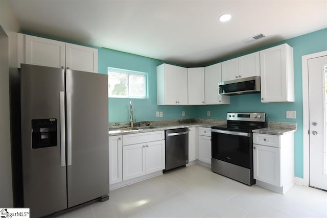 109 Mountain View Ave, Greer, SC 29650 - kitchen with appliances with stainless steel finishes, white cabinets, recessed lighting, and light stone counters