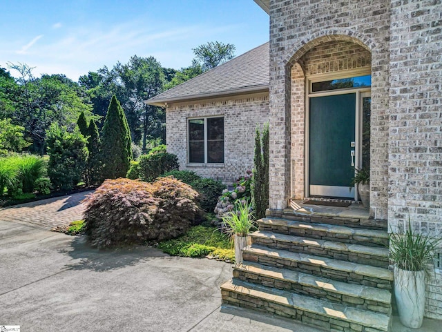6 Avens Hill Dr, Greer, SC 29651 - property entrance featuring brick siding and a shingled roof