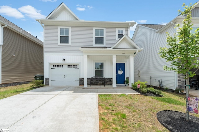 131 Highland Park Ct, Easley, SC 29642 - view of front facade with a garage, board and batten siding, a porch, and driveway