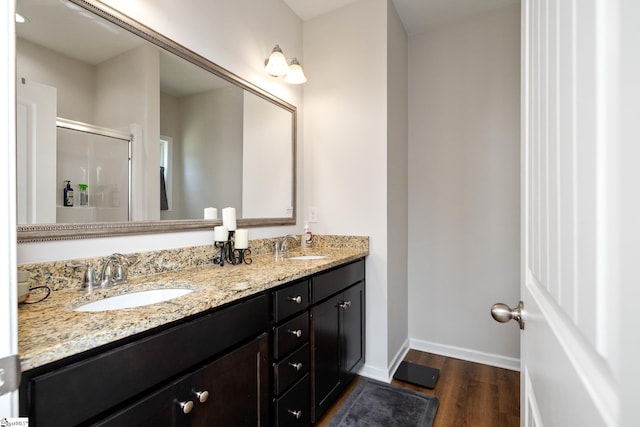131 Highland Park Ct, Easley, SC 29642 - full bathroom with wood finished floors, double vanity, and a stall shower