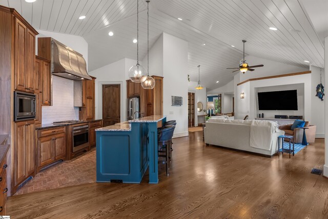 337 Knox Campground Rd, Seneca, SC 29672 - kitchen featuring ventilation hood, appliances with stainless steel finishes, a breakfast bar, brown cabinets, and light stone countertops