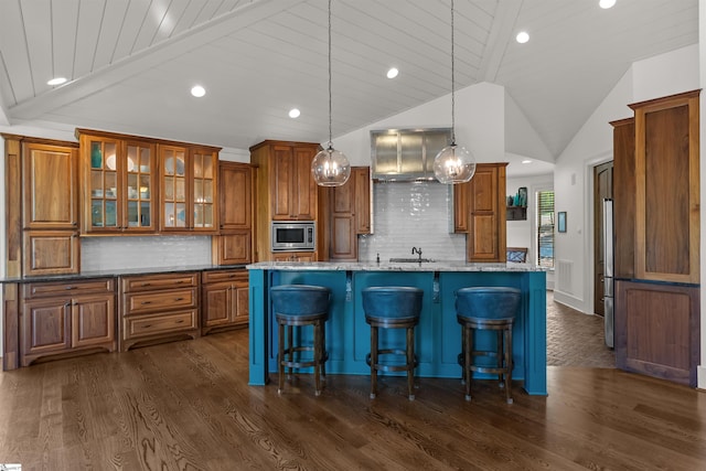 337 Knox Campground Rd, Seneca, SC 29672 - kitchen featuring brown cabinets, stainless steel microwave, recessed lighting, vaulted ceiling, and dark wood-style floors