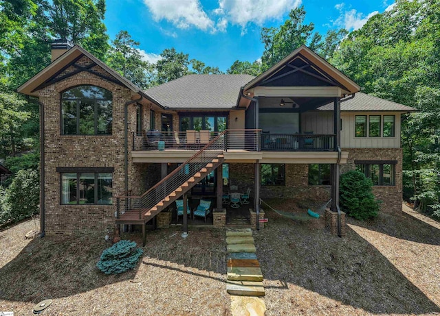337 Knox Campground Rd, Seneca, SC 29672 - back of house with stairs, brick siding, a chimney, board and batten siding, and a wooden deck
