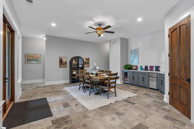 337 Knox Campground Rd, Seneca, SC 29672 - dining room with light stone finish flooring, wine cooler, a ceiling fan, and recessed lighting