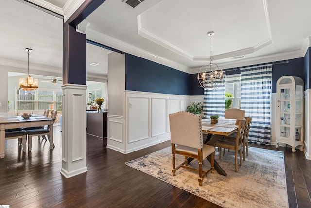 505 Jones Peak Dr, Simpsonville, SC 29681 - dining room featuring a chandelier, dark wood finished floors, a raised ceiling, ornamental molding, and a wainscoted wall