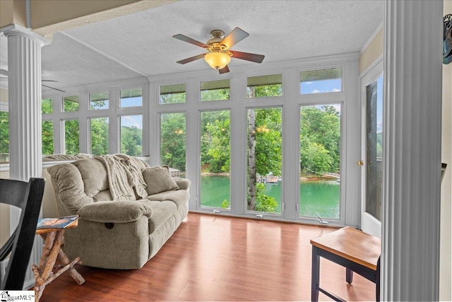 701 Loran Pointe Pointe, Seneca, SC 29672 - sunroom featuring a textured ceiling, ornate columns, wood finished floors, a water view, and french doors