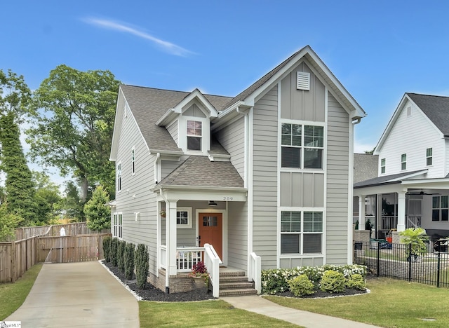 209 Pinckney St, Greenville, SC 29601 - view of front of property with a shingled roof, board and batten siding, and driveway