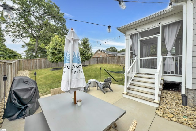 209 Pinckney St, Greenville, SC 29601 - fenced backyard featuring a sunroom, area for grilling, a patio, entry steps, and outdoor dining space