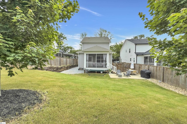 209 Pinckney St, Greenville, SC 29601 - back of property with a patio, a sunroom, and a fenced backyard