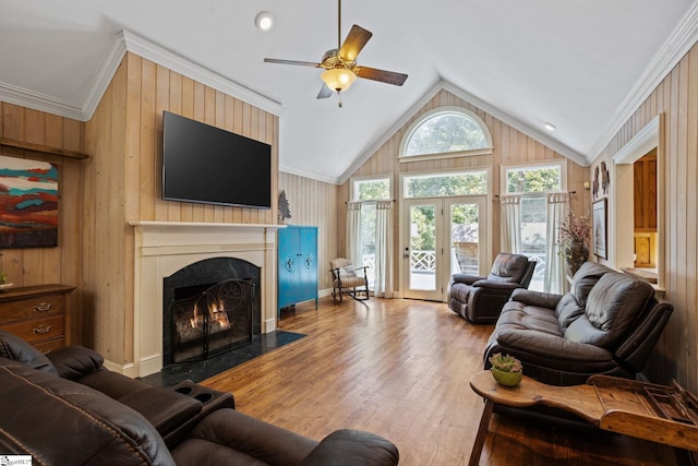 229 Armstrong Rd, Honea Path, SC 29654 - living area with a premium fireplace, wood finished floors, lofted ceiling, a ceiling fan, and french doors