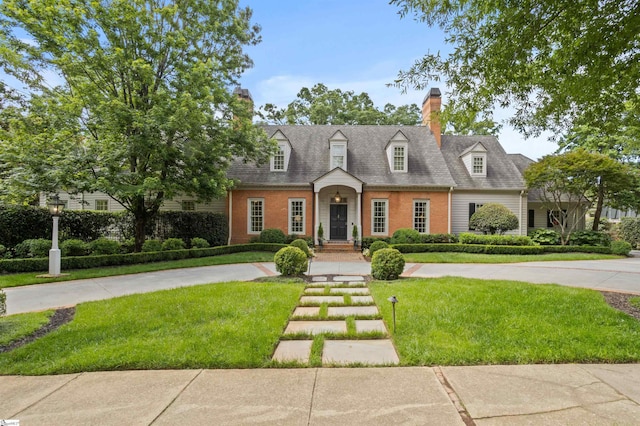 540 Crescent Ave, Greenville, SC 29601 - cape cod home with a front lawn, a chimney, and brick siding