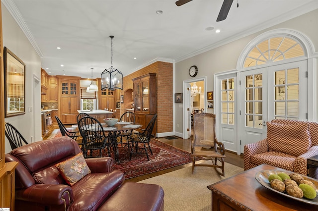 540 Crescent Ave, Greenville, SC 29601 - living room with dark wood finished floors, recessed lighting, ceiling fan, crown molding, and a chandelier