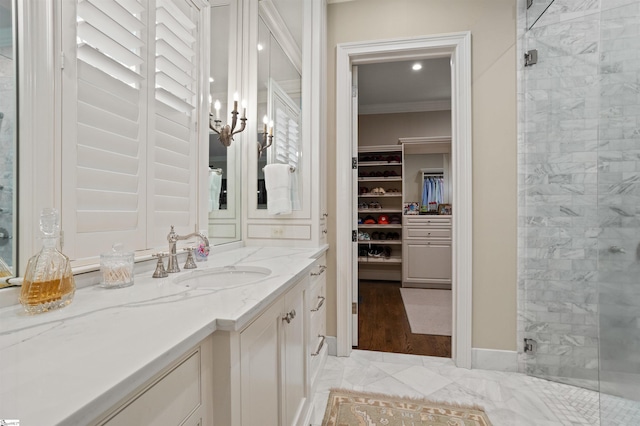 540 Crescent Ave, Greenville, SC 29601 - bathroom with vanity, a spacious closet, a shower stall, crown molding, and marble finish flooring