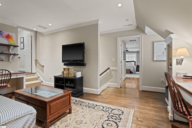 540 Crescent Ave, Greenville, SC 29601 - living area featuring wood finished floors, stairs, crown molding, and recessed lighting