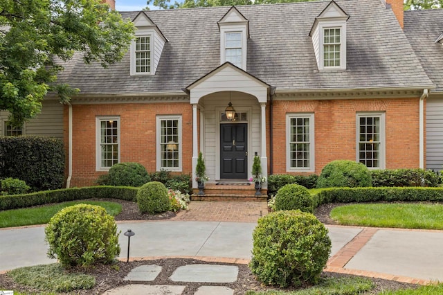 540 Crescent Ave, Greenville, SC 29601 - new england style home with brick siding, a chimney, and a shingled roof
