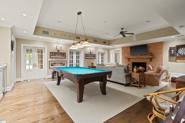 540 Crescent Ave, Greenville, SC 29601 - playroom featuring french doors, crown molding, a fireplace, a tray ceiling, and ceiling fan