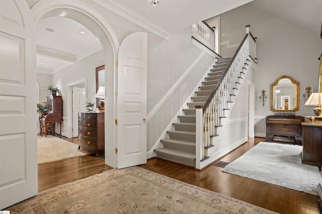 540 Crescent Ave, Greenville, SC 29601 - entrance foyer featuring wood finished floors, stairs, arched walkways, crown molding, and recessed lighting