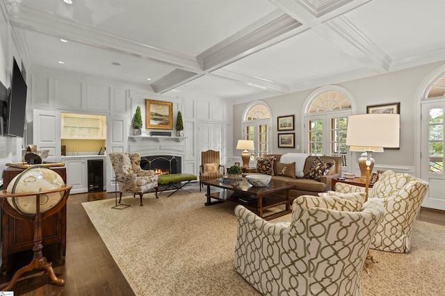 540 Crescent Ave, Greenville, SC 29601 - living area with a decorative wall, dark wood-style floors, beamed ceiling, a warm lit fireplace, and coffered ceiling