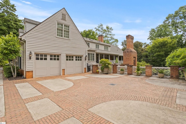 540 Crescent Ave, Greenville, SC 29601 - view of front of home featuring an attached garage, decorative driveway, and brick siding