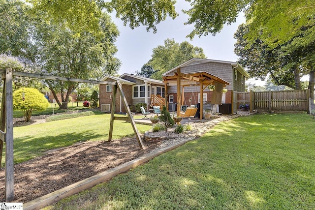103 Birchwood St, Easley, SC 29642 - back of property featuring a fenced backyard, a patio area, and brick siding