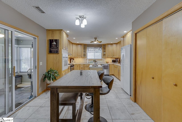 103 Birchwood St, Easley, SC 29642 - kitchen featuring appliances with stainless steel finishes, light countertops, recessed lighting, glass insert cabinets, and ceiling fan