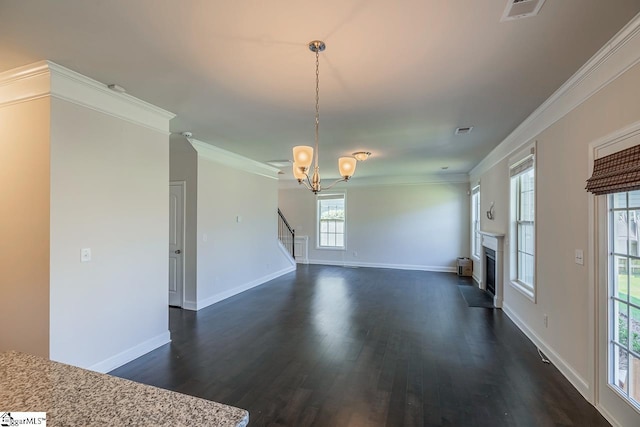 203 Redmont Ct, Simpsonville, SC 29680 - unfurnished living room featuring dark wood-style floors, a chandelier, ornamental molding, a fireplace, and stairs
