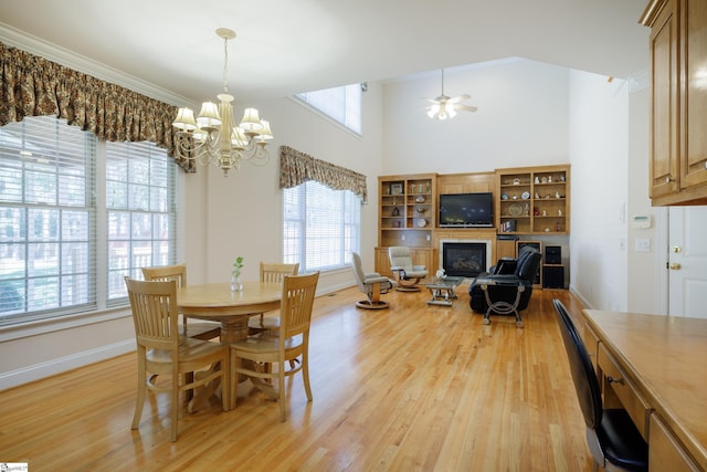 805 Carriage Hill Rd, Simpsonville, SC 29681 - dining space featuring light wood-style flooring, a chandelier, a desk, a ceiling fan, and a high ceiling