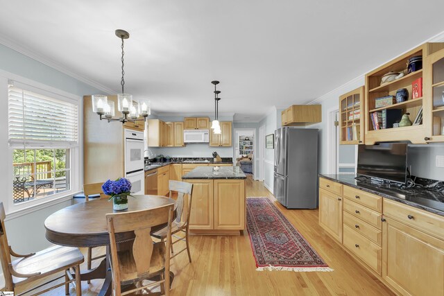 1 Redcliffe Rd, Greenville, SC 29615 - kitchen featuring appliances with stainless steel finishes, ornamental molding, light brown cabinetry, light wood-type flooring, and a chandelier