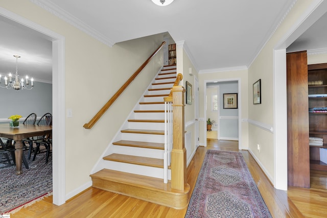 1 Redcliffe Rd, Greenville, SC 29615 - stairs with wood finished floors, crown molding, and a chandelier