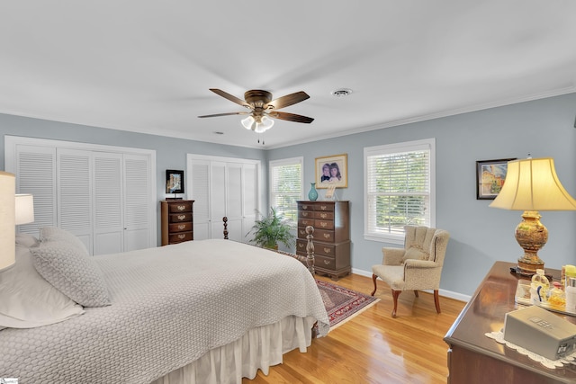 1 Redcliffe Rd, Greenville, SC 29615 - bedroom with two closets, light wood-style floors, crown molding, and ceiling fan